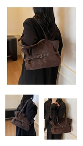 Detail view of caramel faux suede tote bag with decorative strap and metal buckle