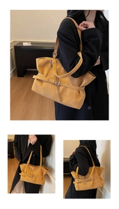 Three-way view of large mustard yellow tote bag showing matte leather and metal buckle