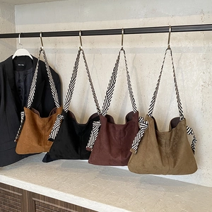 Retro suede tote bucket bag with woven strap in brown, black, burgundy and green