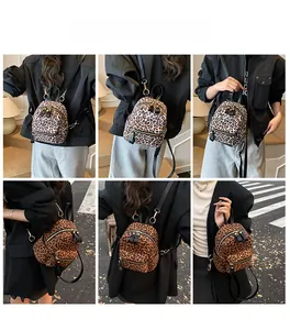 Detail view of mini leopard print backpacks showing dual colors and street style modeling