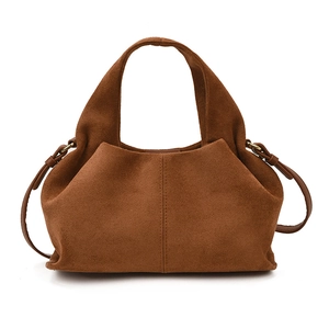 Caramel brown suede cloud dumpling bag with top handles and adjustable crossbody strap