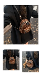 Detail of leopard print mini backpack showing gold hardware and black leather straps