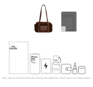 Macro detail of brown suede shoulder bag capacity showing fit for 6.7 inch smartphone
