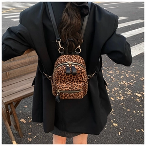 Leopard print mini backpack detail with plush texture and adjustable black straps