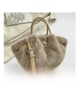 Macro detail of khaki faux fur texture and premium leather handles on luxury winter bag