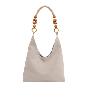 Sac hobo beige minimaliste avec poignée décorative en perles et forme de lune douce