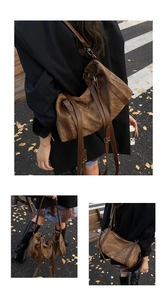 Detail view of retro brown canvas and leather Boston bag styled for street fashion