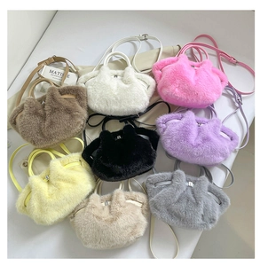 Collection of plush faux fur handbags in various pastel colors with soft curved handles