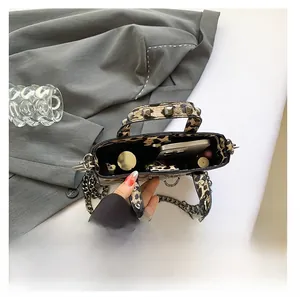 Internal view of leopard print crossbody bag showing space for phone and lipstick