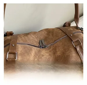 Detail of vintage brown bag with double metal zippers and high-quality hardware texture