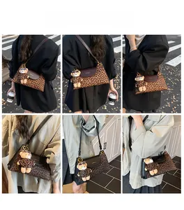 Detailed views of leopard print crossbody bag with cute bear charm and brown leather trim