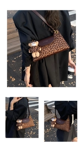 Close-up of leopard print shoulder bag with brown leather flap and plush bear charm