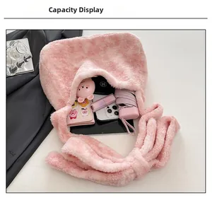 Spacious pink plush bag interior showing capacity for tablet, phone and cosmetics