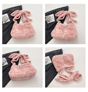Detail view of pink plush bucket bag with oversized bow handle from multiple angles