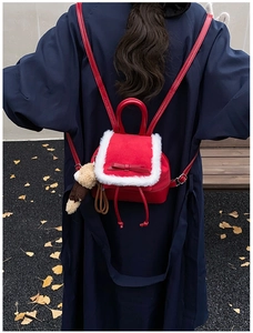 Mini red backpack with white plush trim, bow detail, and a cute brown bear pendant charm