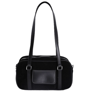 Retro black baguette shoulder bag with suede and leather textures on a white background