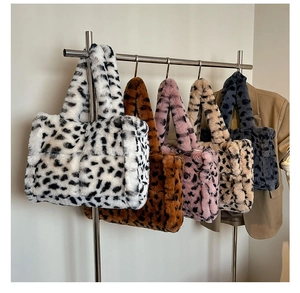 Multiple color options of large leopard print plush tote bags on a display rack