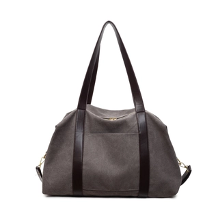 Large gray canvas tote bag with brown leather handles and adjustable shoulder straps