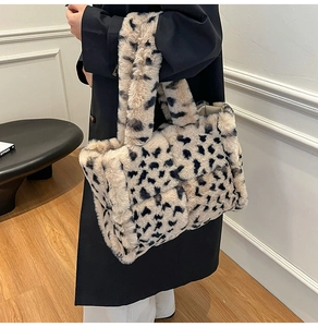 Close-up of leopard print plush tote bag showing soft faux fur texture and pattern