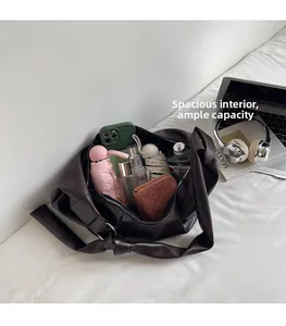 Top view of spacious brown soft leather tote bag showing large capacity for daily items