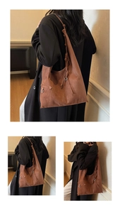 Detailansicht der braunen Wildledertasche mit Knotengurt und silbernen Metallringen