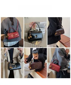 Detailed views of vintage crossbody bags with metallic gold locks and decorative tassels