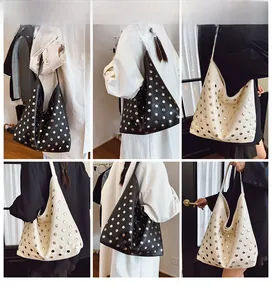 Detailed views of punk-style rivet hobo bag showing shoulder and handheld wear