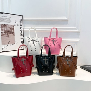 Gothic bucket handbags with metal cross and studs in five colors on a white background