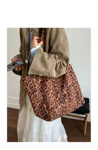 Leopard print suede tote bag styled with a brown coat for a vintage fashion look