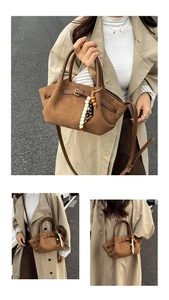 Detail of brown matte bucket bag with bohemian beads and detachable strap