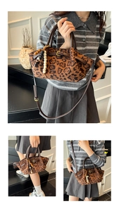 Detail of leopard print bucket bag with leather handles and bohemian bead charm
