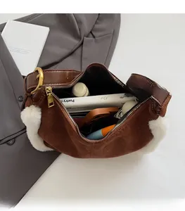 Detailed interior of brown suede tote with faux shearling showing large storage capacity