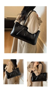 Detail view of the sleek black leather tote bag with stylish long drawstring decoration
