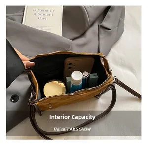 Internal view of the brown cylinder bag showing its large capacity for daily items