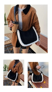 Detail of vintage matte crossbody bag with contrast faux shearling trim and saddle shape