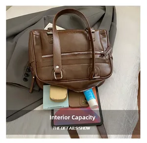 Spacious interior of dark brown tote bag holding tablet, phone and makeup essentials