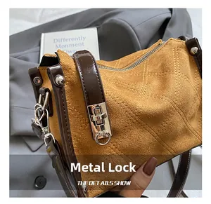 Detailed close-up of premium silver twist lock and quilted leather on luxury handbag