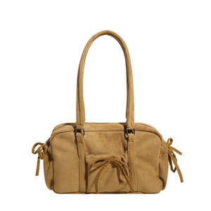 Bolso de hombro retro de ante amarillo jengibre con lazos y acabado mate suave