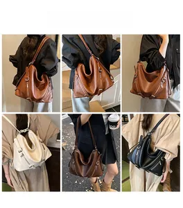 Litchi texture leather tote bag showing multiple carrying styles on a female model