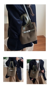 Detail view of dark brown suede bucket bag with green leather handle and silver metal turn lock