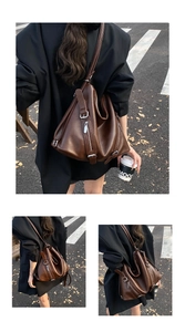 Detailed view of dark coffee vintage tote bag with functional zippers and long straps