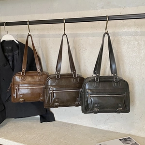 Retro workwear pillow bag in three colors with metallic buckles and oil wax finish