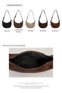 Detail view of crescent shoulder bag with interior fabric lining and zipper closure