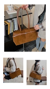 Détail d'un sac cabas en daim marron foncé avec boucle réglable et texture mate vintage