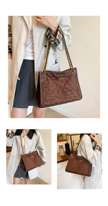 Detail of dark brown quilted suede tote bag with elegant gold chain strap and metal lock