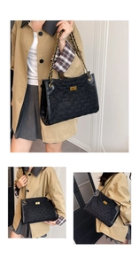 Detail of black quilted chain shoulder bag featuring gold square lock and elegant texture