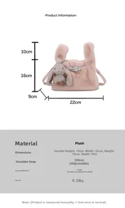 Detailed view of pink plush handbag with bunny charm and adjustable shoulder strap