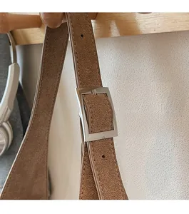 Detail of premium silver square metal buckle on brown leopard tote bag shoulder strap
