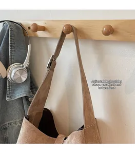 Detail view of large brown leopard tote bag with adjustable shoulder strap and matte finish