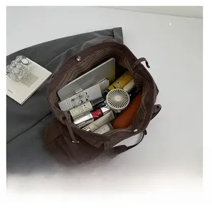 Interior view of large suede tote bag showing storage capacity for tablet and essentials
